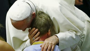 Pope Francis embraces a child during a special audience with parish cells. (File: Reuters)