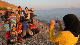 Refugees snap selfies to celebrate journey to new shores