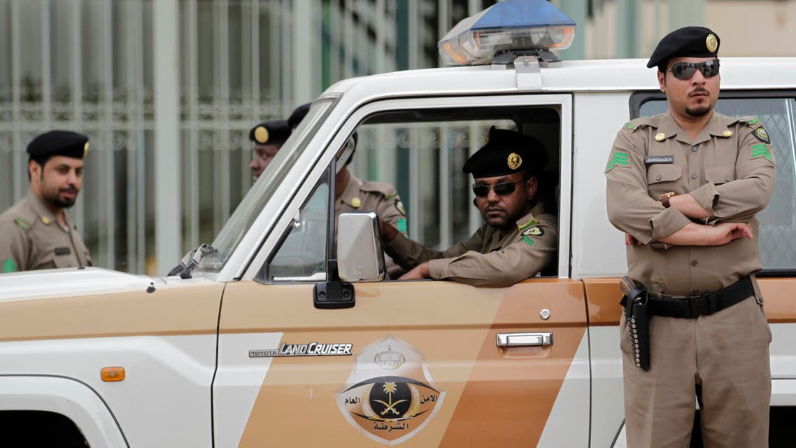  Saudi policemen form a check point near the site where a demonstration was expected to take place in Riyadh, Saudi Arabia, Friday, March 11, 2011. Hundreds of police have deployed on the streets of the Saudi capital ahead of planned protests calling for democratic reforms in the kingdom. The rare security turnout highlights authorities' concerns about the possibility of people gathering after Friday prayers. Although protests have so far been confined to small protests in the country's east where minority Shiites live, activists have been emboldened by other uprisings and have set up online groups calling for protests in Riyadh Friday. (AP Photo/Hassan Ammar)