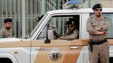  Saudi policemen form a check point near the site where a demonstration was expected to take place in Riyadh, Saudi Arabia, Friday, March 11, 2011. Hundreds of police have deployed on the streets of the Saudi capital ahead of planned protests calling for democratic reforms in the kingdom. The rare security turnout highlights authorities' concerns about the possibility of people gathering after Friday prayers. Although protests have so far been confined to small protests in the country's east where minority Shiites live, activists have been emboldened by other uprisings and have set up online groups calling for protests in Riyadh Friday. (AP Photo/Hassan Ammar)