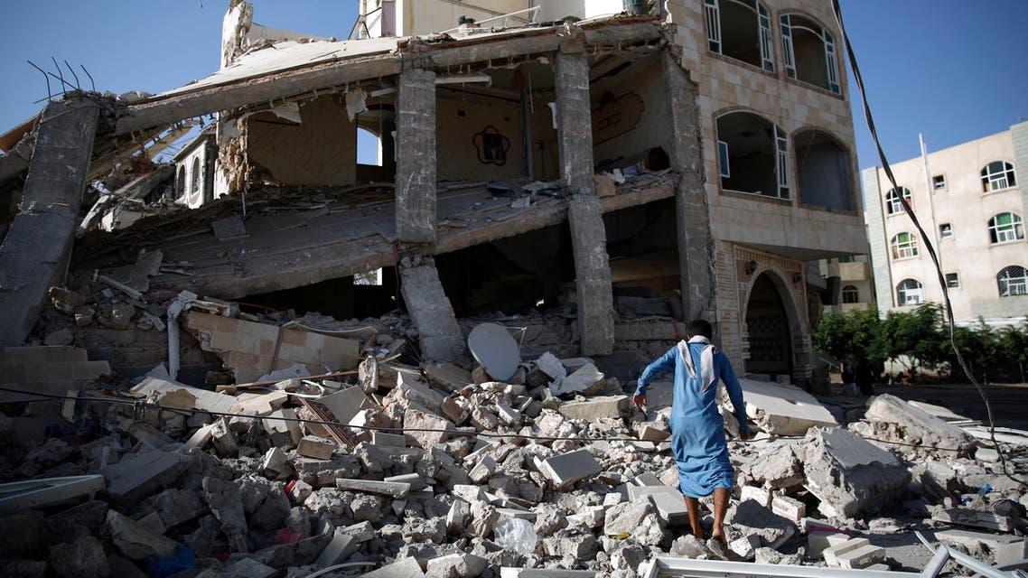 A man, walks amid the rubble of a house destroyed by a Saudi-led airstrike in Sanaa, Yemen, Tuesday, Sept. 8, 2015. (AP Photo/Hani Mohammed)