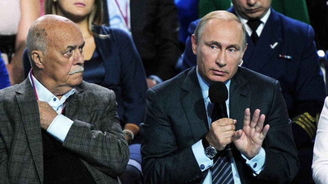 Russian President Vladimir Putin, right, speaks during a meeting with his supporters in Moscow, Russia, Monday, Sept. 7. (AP)