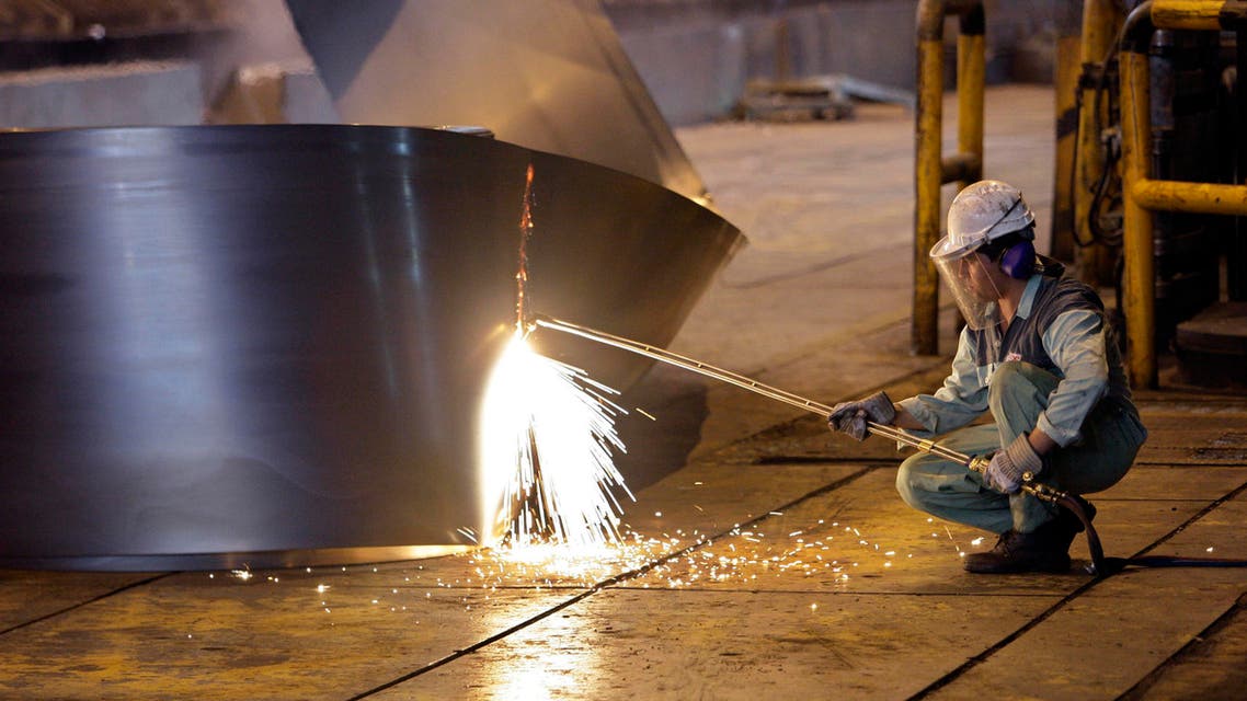 an Iranian worker cuts a steel roll at the Mobarakeh Steel Complex, some 2460km south of the capital Tehran. (File photo:AP)