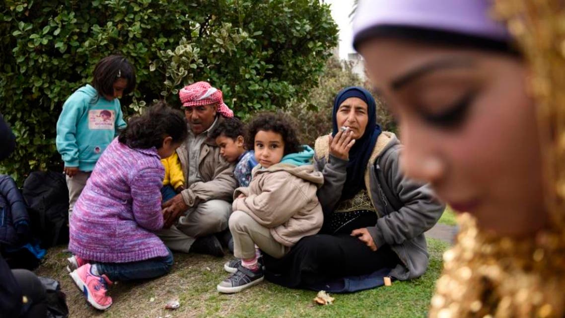 Syrian refugees gather outside the government house at Independence Square, in Montevideo, Uruguay, Monday, Sept. 7, 2015. (AP)