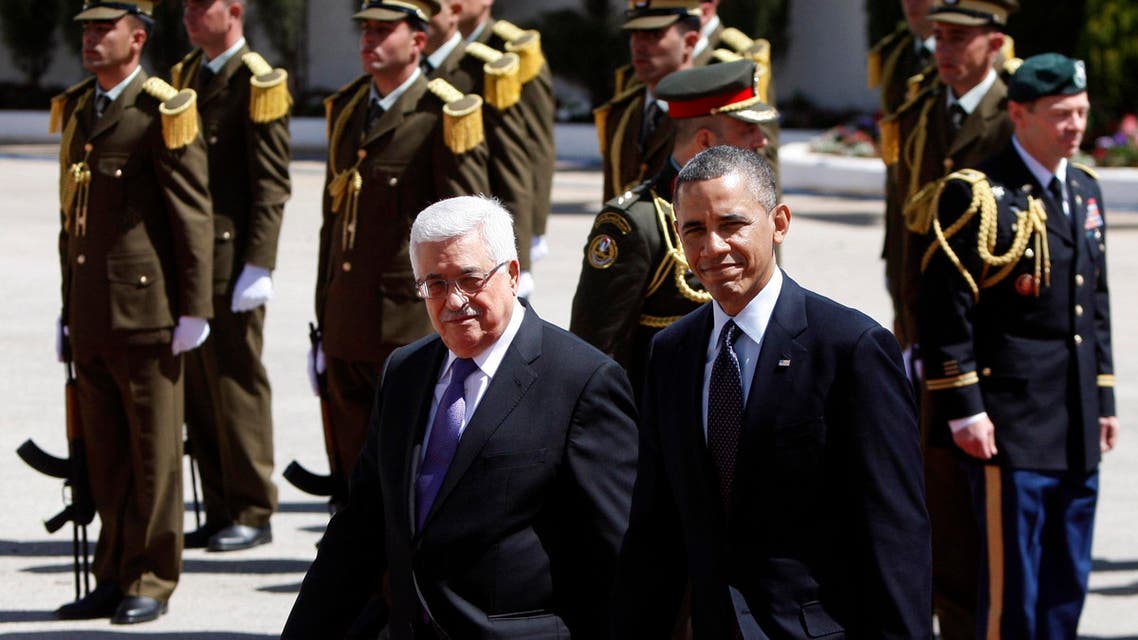 US President Barack Obama, right, walks with Palestinian President Mahmoud Abbas, during a welcoming ceremony prior to their meeting, in the West Bank city of Ramallah, Thursday, March. 21, 2013. Obama is meeting Palestinian officials on the second day of his Mideast tour to emphasize the importance of reaching an Israeli-Palestinian peace deal. (AP Photo/Majdi Mohammed)