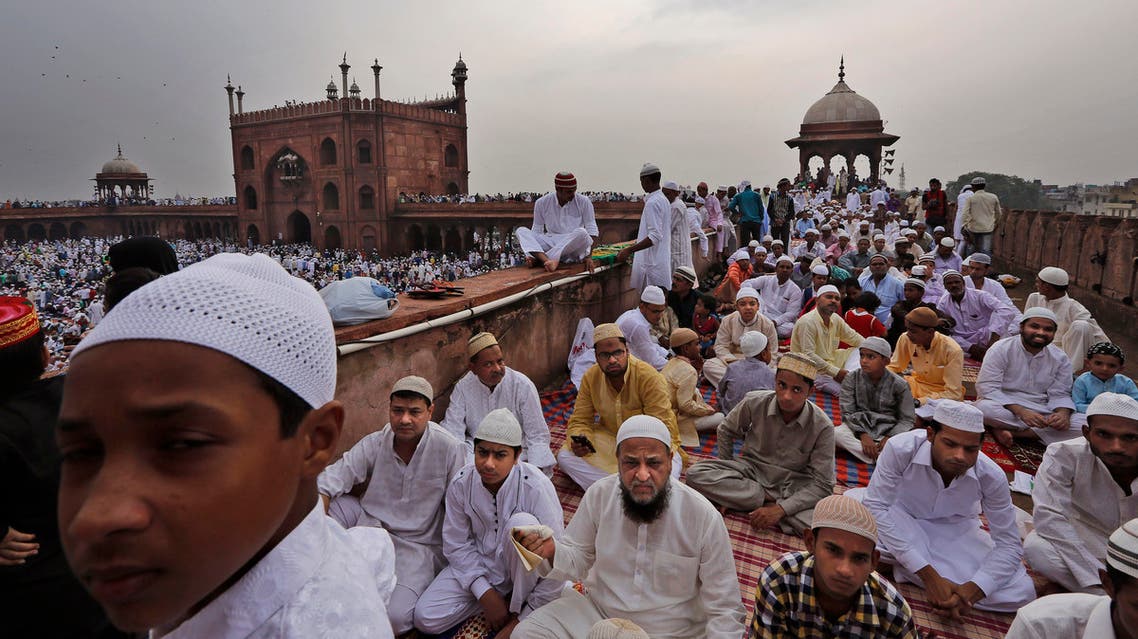  Indian Muslims wait to offer Eid al-Fitr prayers at Jama Masjid or Grand Mosque in New Delhi, India, Saturday, July 18, 2015. Millions of Muslims across the world are celebrating the Eid al-Fitr holiday, which marks the end of the month-long fast of Ramadan. (AP Photo/Manish Swarup)