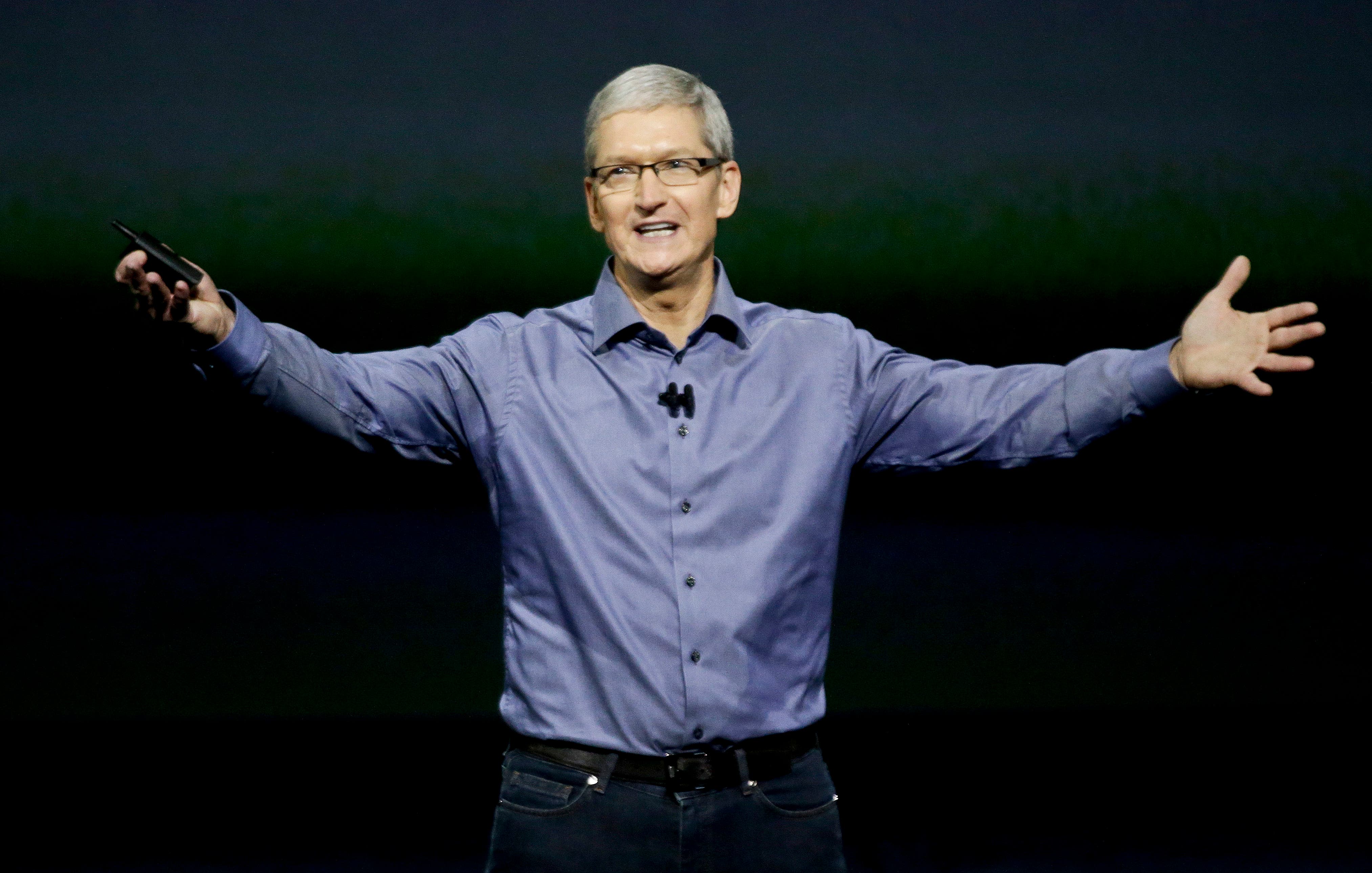 Apple CEO Tim Cook wraps up the latest Apple event at the Bill Graham Civic Auditorium in San Francisco, Wednesday, Sept. 9, 2015. (AP Photo/Eric Risberg)