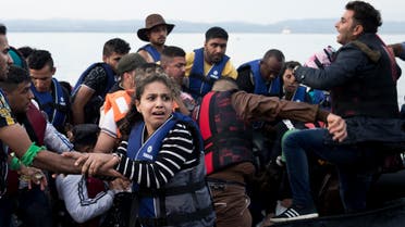  Syrian refugees arrive on a dinghy after crossing from Turkey to Lesbos island, Greece, Wednesday, Sept. 9, 2015. The head of the European Union's executive says 22 of the member states should be forced to accept another 120,000 people in need of international protection who have come toward the continent at high risk through Greece, Italy and Hungary. (AP Photo/Petros Giannakouris)