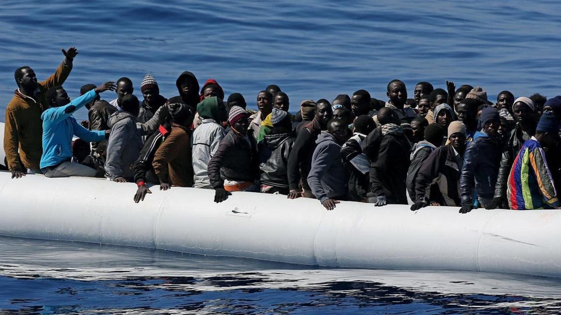 In this photo made available Thursday, April 23, 2015, migrants crowd and inflatable dinghy as rescue vassel " Denaro " (not in picture) of the Italian Coast Guard approaches them, off the Libyan coast. (File photo: AP)