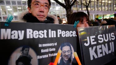 People gather to mourn two Japanese hostages, Kenji Goto and Haruna Yukawa, who were killed by the Islamic State group, in Tokyo,