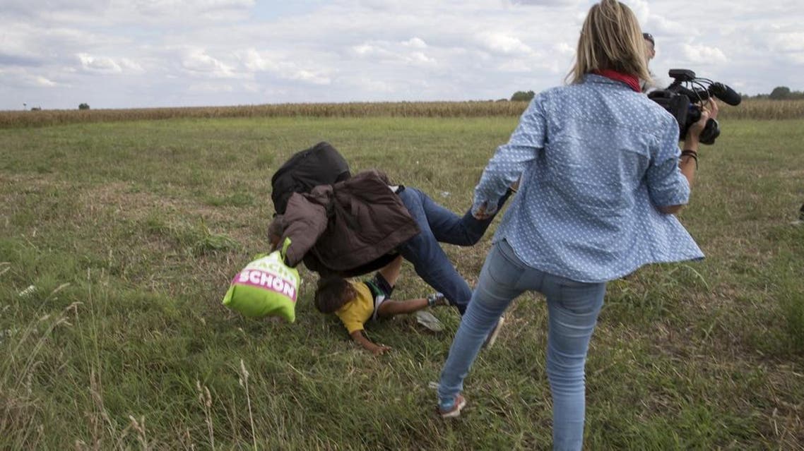 Combination picture (L to R) shows a migrant carrying a child tripping on TV camerawoman Petra Laszlo and falling while trying to escape from a collection point in Roszke village, Hungary, September 8, 2015. Laszlo, a camerawoman for a private television channel in Hungary, was fired late on Tuesday after videos of her kicking and tripping up migrants fleeing police, including a man carrying a child, spread in the media and on the internet. REUTERS/Marko Djurica