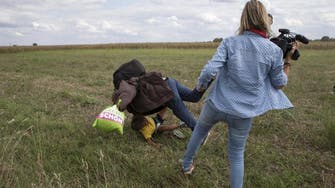 Fired Hungarian camerawoman apologizes for kicking migrants