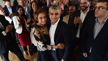 British Labour Party politician Sadiq Khan (CR) embraces his wife Saadiya (CL) after being selected to be Labour's candidate for the 2016 London mayoral election. (AFP)