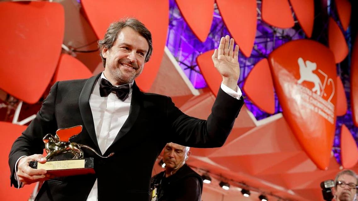 Director Lorenzo Vigas poses with the Golden Lion for best film for 'Desde Alla' (From afar) on the red carpet at the end of the awards ceremony of the 72nd edition of the Venice Film Festival in Venice, Italy, Saturday, Sept. 12, 2015. (AP)