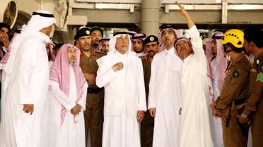 Saudi governor of Mecca region Khaled al-Faisal (C) listens to aides of the Grand Mosque of Saudi Arabia's holy Muslim city of Mecca on September 11, 2015, after a construction crane crashed into it. afp