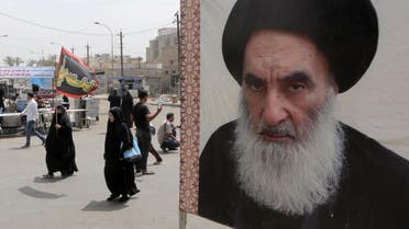 A poster of Shiite spiritual leader Grand Ayatollah Ali al-Sistani, right, in Baghdad, Iraq, Thursday, May 22, 2014. (File photo: AP)