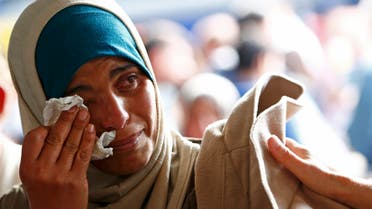 yrian refugee Asmaa wipes tears as she waits for a train on the platform at the main railway station in Munich, Germany September 13, 2015. (Reuters)