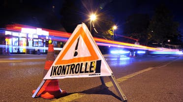    aug102 - Lindau, Bavaria, GERMANY : A sign reading 'control' ('Kontrolle') stands on the road at the German-Austrian border near Lindau, southern Germany, on September 13, 2015. Germany said it was reinstating border controls on Sunday as Europe's top economy admitted it could no longer cope with a record influx of refugees. AFP PHOTO / DPA / STEFAN PUCHNER +++ GERMANY OUT