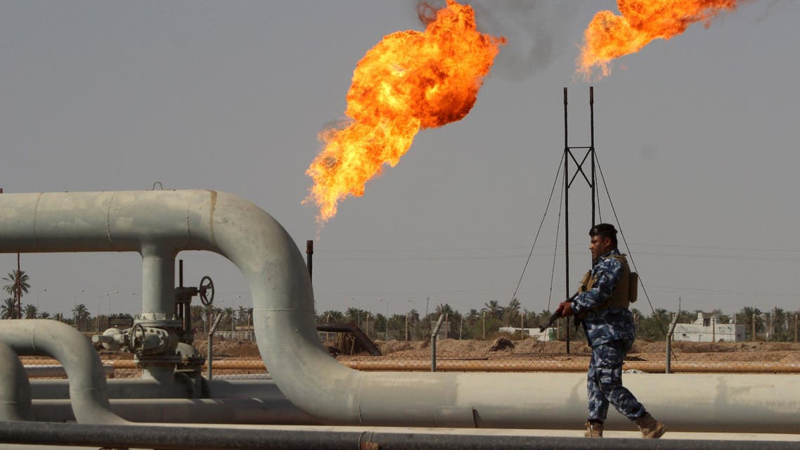 A member of the oil police force walks at Nahr Bin Umar oil field, north of Basra, southeast of Baghdad August 19, 2015. Iraq's oil exports have fallen by at least 250,000 barrels per day (bpd) so far in August according to loading data, making it less likely the several-month trend of rising OPEC output that has weakened oil prices will be sustained this month. REUTERS/Essam Al-Sudani