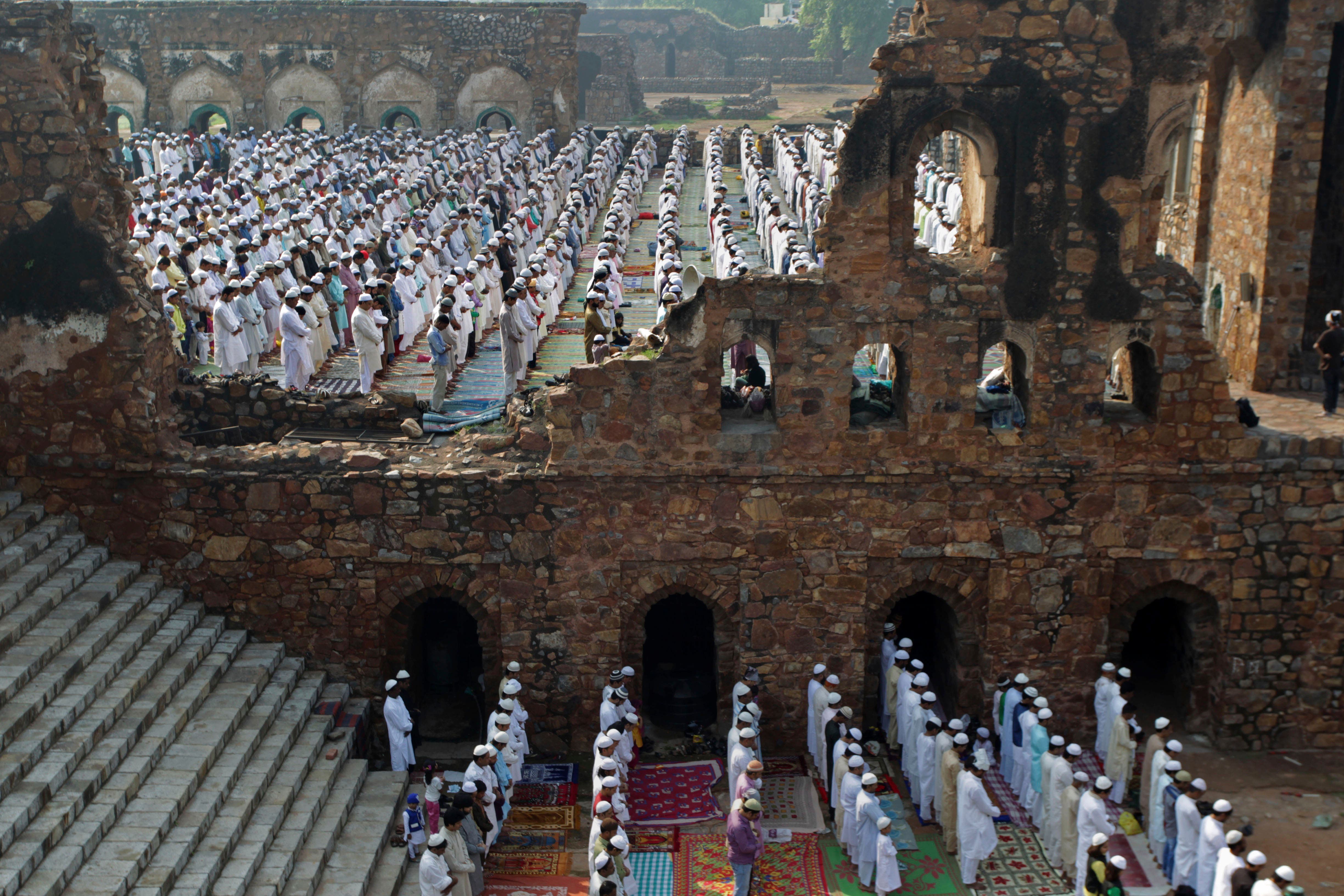  India Muslims offer prayers at the Ferozshah Kotla Mosque during Eid al-Adha in New Delhi, India, Wednesday, Oct. 16, 2013. Eid al-Adha is a religious festival celebrated by Muslims worldwide to commemorate the willingness of Prophet Ibrahim to sacrifice his son as an act of obedience to God. (AP Photo/Tsering Topgyal)