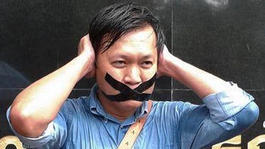 Pravit Rojanaphruk, an outspoken Thai columnist for the English-language daily The Nation, poses for a photograph while being called to report himself to the ruling military last year. (File photo: AP)