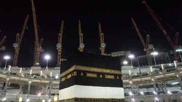 Towering construction cranes used in the ongoing expansion the Grand Mosque overlook the Kaaba, the cubic building at the mosque in the Muslim holy city of Mecca, Saudi Arabia, Sunday, Sept. 13, 2015. (AP Photo/Mosa'ab Elshamy)