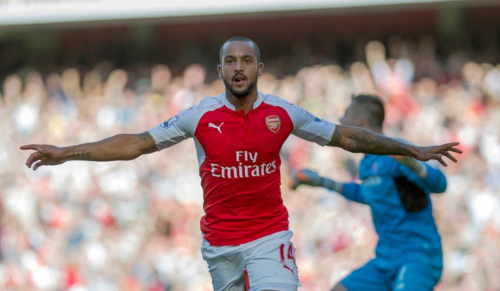 Arsenal's Theo Walcott celebrates after scoring against Stoke City, during their English Premier League soccer match between Arsenal and Stoke City, at Emirates Stadium, in London, Saturday, Sept. 12, 2015. (AP Photo/Bogdan Maran)