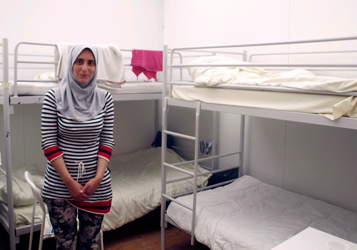 In this photo taken on Thursday, July 30, 2015, Syrian refugee Leila, no last name given, poses in an emergency shelter in Berlin where she waits with her family for her pending registration as asylum seekers. (AP)