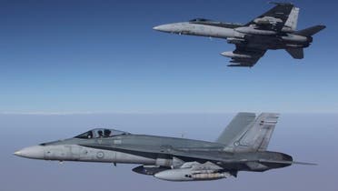 This photo taken on September 11, 2015 and released by the Royal Australian Air Force shows F/A-18A Hornets from Australia's Air Task Group flying in formation after refueling during the first mission of Operation OKRA to be flown over Syria. (AFP)