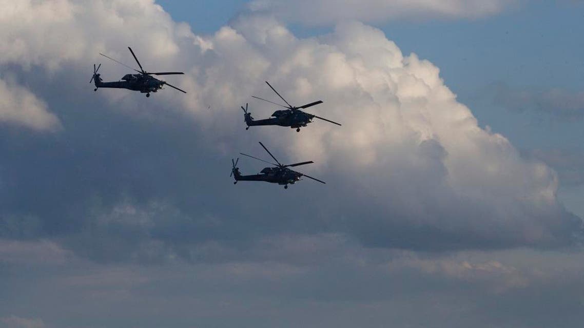 Russian MI-28 attack helicopters fly during the Army-2015 show at a shooting range in Alabino, outside of Moscow, Russia, on Tuesday, June 16. (File photo: AP)