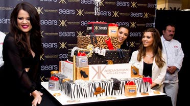 Kardashian sisters, from left, Khloe, Kim and Kourtney celebrate the one year anniversary of the Kardashian Kollection at Sears on Friday, Sept. 14, 