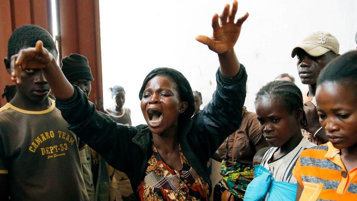Diane Seresona is overwhelmed by grief as she sees the body of Prudence Seresona, 27, who just passed away from Malaria at the makeshift IDP camp in Bangui. (File photo: AP)