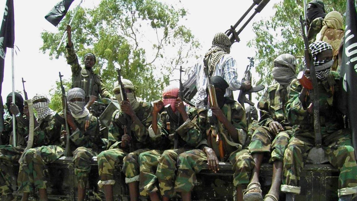 Al-Shabaab fighters display weapons as they conduct military exercises in northern Mogadishu, Somalia, Thursday, Oct. 21, 2010,