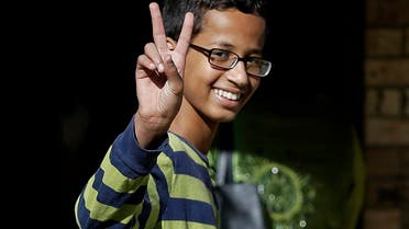 Ahmed Mohamed, 14, gestures as he arrives to his family's home in Irving, Texas, Thursday, Sept. 17, 2015. Ahmed was arrested Monday at his school after a teacher thought a homemade clock he built was a bomb. He remains suspended and said he will not return to classes at MacArthur High School. (AP Photo/LM Otero)