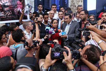Egyptian student Mariam Malak (C), 19, talks to the press outside the syndicate of journalists in the capital Cairo on September 17, 2015.