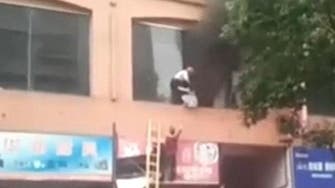 Toddler thrown from nursery window in China to escape fire 