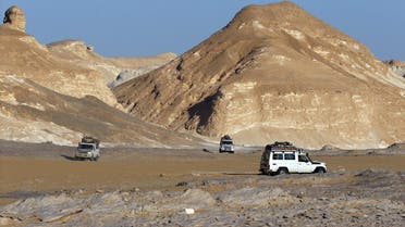 Four-wheel drive cars cross the Egyptian western desert and the Bahariya Oasis. (Reuters)