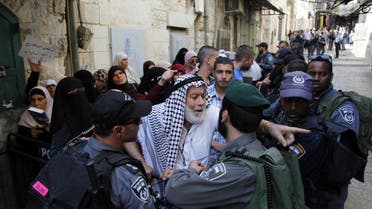 A Palestinian man argues with an Israeli border police officer during a protest in Jerusalem's Old City on Thursday, Sept. 17, 2015. (AP)
