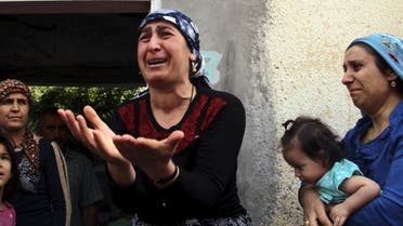 A Turkish Kurdish woman reacts as she talks to visiting journalists in the southeastern town of Cizre in Sirnak province, Turkey, September 12, 2015. (Reuters)