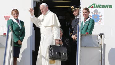 Pope Francis waves as he boards a plane at Fiumicino Airport in Rome September 19, 2015. Pope Francis begins a nine-day tour of Cuba and the United States on Saturday where he will see both the benefits and complexities of a fast-evolving detente between the old Cold War foes that he helped broker. REUTERS/Giampiero Sposito TPX IMAGES OF THE DAY
