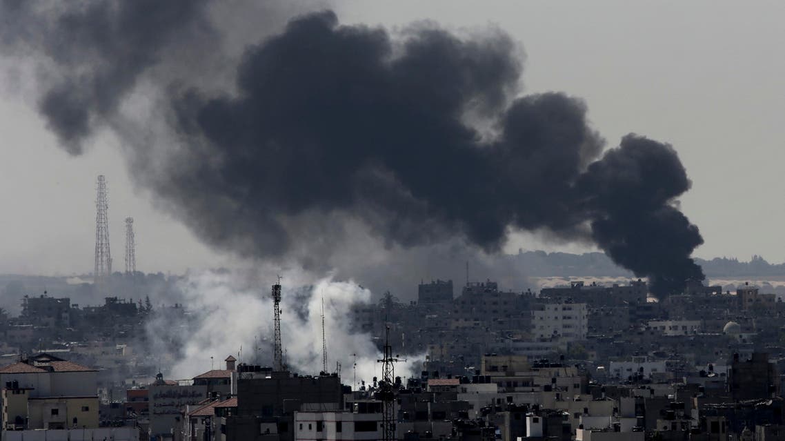 Smoke from Israeli strikes rises over Gaza City, in the northern Gaza Strip, Sunday, July 27, 2014.ap