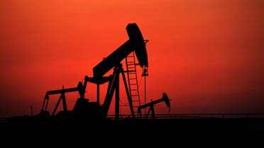  Oil pumps work at sunset on Wednesday, Sept. 11, 2013, in the desert oil fields of Sakhir, Bahrain. ap
