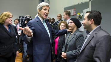 U.S. Secretary of State John Kerry (C) meets with refugees fleeing Syria at Villa Borsig in Berlin, Germany, September 20, 2015. (Reuters)
