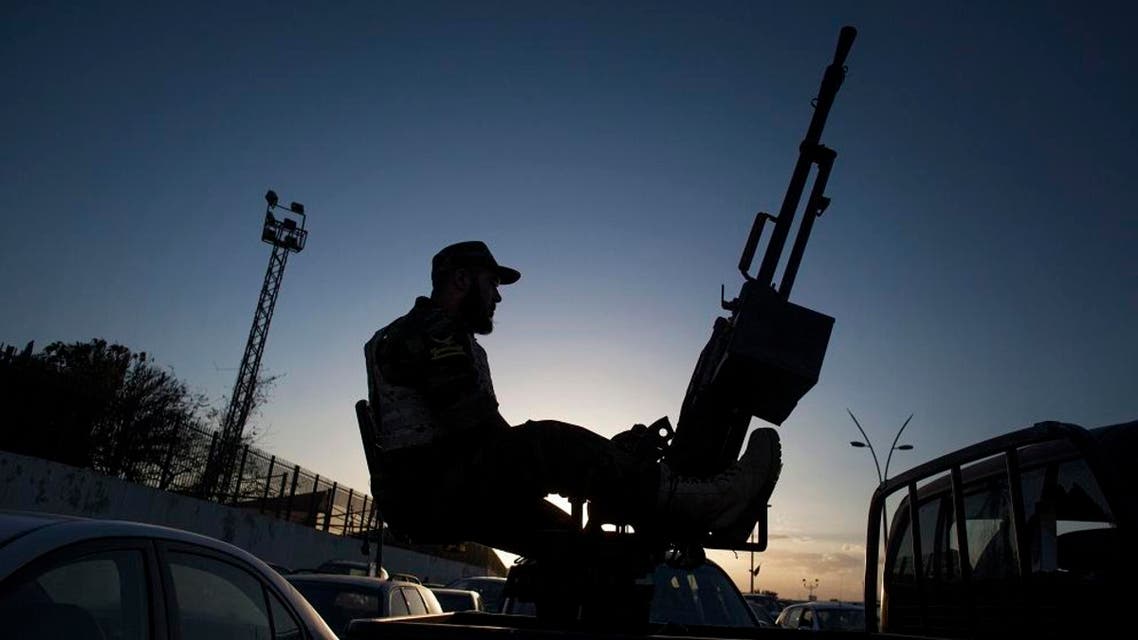 A Libyan army soldier stands guard sitting on an antiaircraft truck. (Reuters)