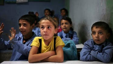 Syrian refugee students sit in their classroom at a Lebanese public school where only Syrian students attend classes in the afternoon in Kaitaa village in north Lebanon. (File: AP)