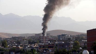Smoke billows from a fire during firefight between the police and Kurdistan Workers' Party, or PKK militants in the town of Silopi, southeastern Turkey, Friday, July 7, 2015. Police clashed with supporters of a Kurdish rebel group in southeastern Turkey on Friday in a four-hour gunfight that killed three people, Turkey's state-run news agency reported. Violence has flared between the autonomy-seeking PKK, and Turkey's security forces in the past two weeks, wrecking an already fragile peace process between the government and the rebels. (Mehmet Selim Yalcin/Dogan News Agency via AP)