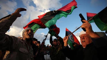 Libyans wave national flags as they chant pro-revolutionary slogans during commemorations to mark the second anniversary of the revolution that ousted Moammar Gadhafi in Benghazi, Libya, Friday, Feb, 15, 2013. (AP)