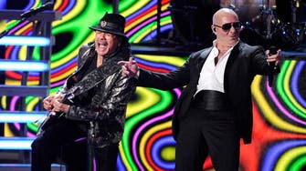 Carlos Santana, Pitbull in pro-immigrant song
