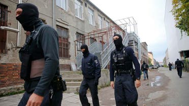 German special police members walk near a mosque association property in Berlin. (Reuters)