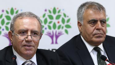   178 - Ankara, Ankara, TURKEY : Turkey's Minister for EU Affairs Ali Haydar Konca (L) and Development Minister Muslum Dogan hold a press conference at the headquarters of the Peoples' Democratic Party (HDP) headquarters in Ankara on September 22, 2015, after resigning from the interim government. The two Kurdish ministers accused Turkey's government of promoting a "logic of war" as they quit the cabinet on September 22, two months after the resumption of fighting between the army and Kurdish rebels. AFP PHOTO / ADEM ALTAN